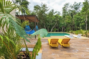 A pool area with lounge chairs and a covered seating area. - Xpu-ha Beachfront Villa 1: Private Pool & Gym (Xpu-Ha)