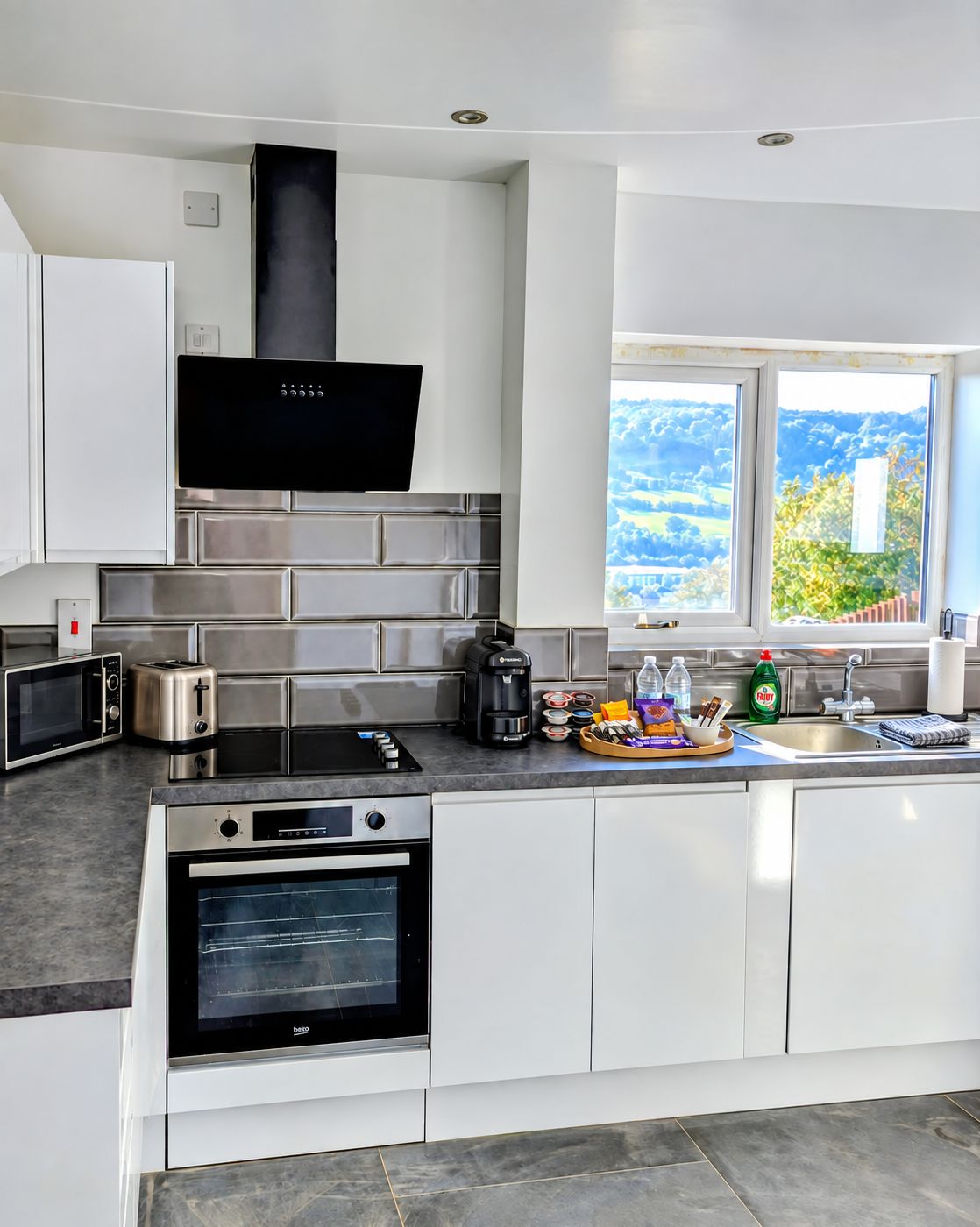 Bright modern kitchen with countryside views and thoughtful welcome treats