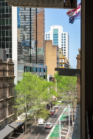 A city street with buildings, trees, and parked cars. - The Midtown Studio Sydneys Magic All Around You (Sydney)