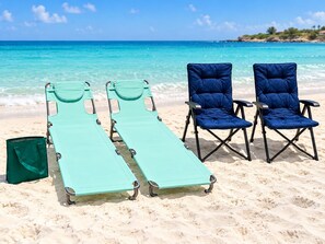 Beach-ready extras are provided for your stay, including two reclining beach loungers, two folding beach chairs, and a beach tote. - Walk-Out to Pool |Jacuzzi, BBQ & White Sand Lounge (Noord)