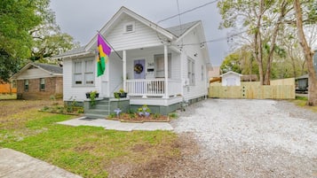 A single-story house with a porch, a mailbox, and a number '360' on the front door.
