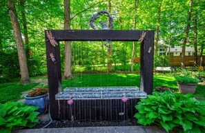 A wooden structure with a circular top, surrounded by lush greenery and trees. - ZEN ON O'RYAN  5 BEDROOM HOUSE IN OXFORD OHIO (Oxford)