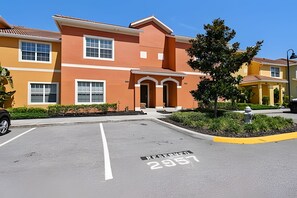 A parking lot with a reserved space marked 2957. - 4BR Paradise Palms Home With Pool (Kissimmee)