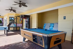 A pool table in a room with yellow walls and ceiling fans. - Vista Cay 3BR Townhome Near Universal & Occc (Orlando)
