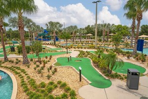 A golf course with multiple water hazards and a pool area. - Family Home at Storey Lake w/ Pool (Kissimmee)