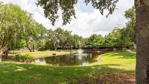 A park with a pond, trees, and a grassy area. - Disney 3BR Villa in Lucaya Harbor Resort (Kissimmee)