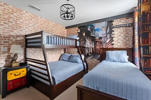 A bunk bed room with a brick wall, a bookshelf, and a lamp. - 5BR w/ South Pool, Game Room Storey Lake (Kissimmee)