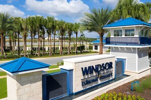 A building with a sign that reads "Windsor Island Resort". - Windsor Island 5BR Villa w/ Pool & Game Room (Davenport)