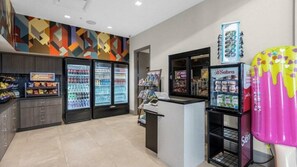 A snack bar with refrigerated drinks and a vending machine. - 6BR Luxury Villa Paradiso Grande Near Disney (Orlando)