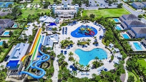 A resort with a large pool, water slides, and multiple guest buildings. - 9BR Villa w/ Pool & Spa (Kissimmee)