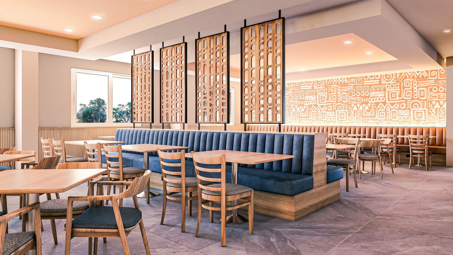 Ein Restaurantinnenraum mit Sitzboxen, Tischen und Stühlen.