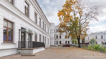 A building with a classical architectural style, featuring symmetrical windows and a central entrance.