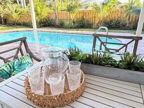 Renovated pool area w/a large patio, grill and lounge chairs. - "Coastal Retreat" Spacious & Newly Renovated w/Tropical Heated Pool-Near Beach (Stuart)