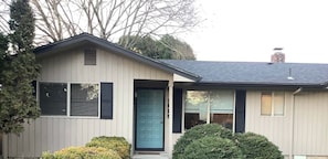 A single-story house with a front door, a chimney, and a small porch. - 2 Bedroom desirable Ferry Street Bridge ! Casa 15 (Eugene)