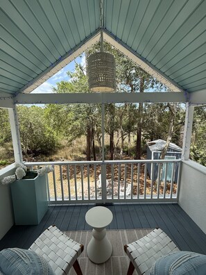 A covered porch with a view of trees and a small shed. - Coastal Marsh-View Retreat with 3BR/3BA + Office & Near Historic Downtown (St. Augustine)