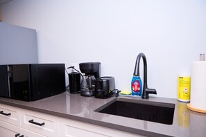A kitchen with a coffee maker, toaster, and cleaning supplies. - Ruby's Place.
Extremely neat and quiet place. Very close to basic malls and uofm (Winnipeg)