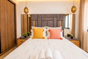 A neatly made bed with a headboard, two bedside tables, and decorative pillows. - AS29 Moroccan Charm Downtown / Free Parking / Wi-Fi (Casablanca)
