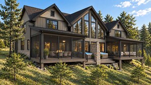 A large, modern house with multiple decks and large windows, surrounded by a forested landscape. - Branson Lakefront Retreat | Pool, Dock & Fishing | Free Slip! (Hollister)