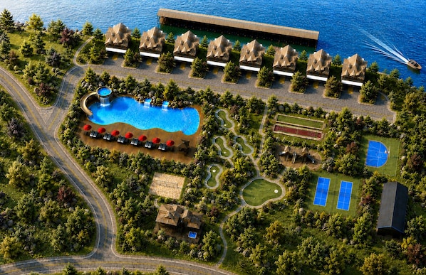 An aerial view of a resort with a swimming pool, tennis courts, and a boat on the water. - New Lakefront Lodge | Beautiful Views | Pool, ChipnPutt, Fire Pit (Hollister)