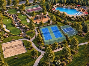 A golf course with a tennis court, a swimming pool, and a playground. - New Luxury Lakefront Lodge | Stay, Play & Fish | Private Dock & Slip (Hollister)