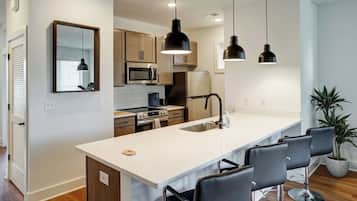 Bright modern kitchen with large island seating for 4