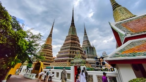 A temple complex with tiered spires and intricate decorations. - A room Asiatique (Bang Kho Laem)