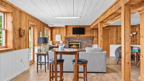 The lower level guest suite features a fireplace and smart TV for evenings at home - The Water Lily | Charming Waterfront Retreat | 4BR (Hendersonville)