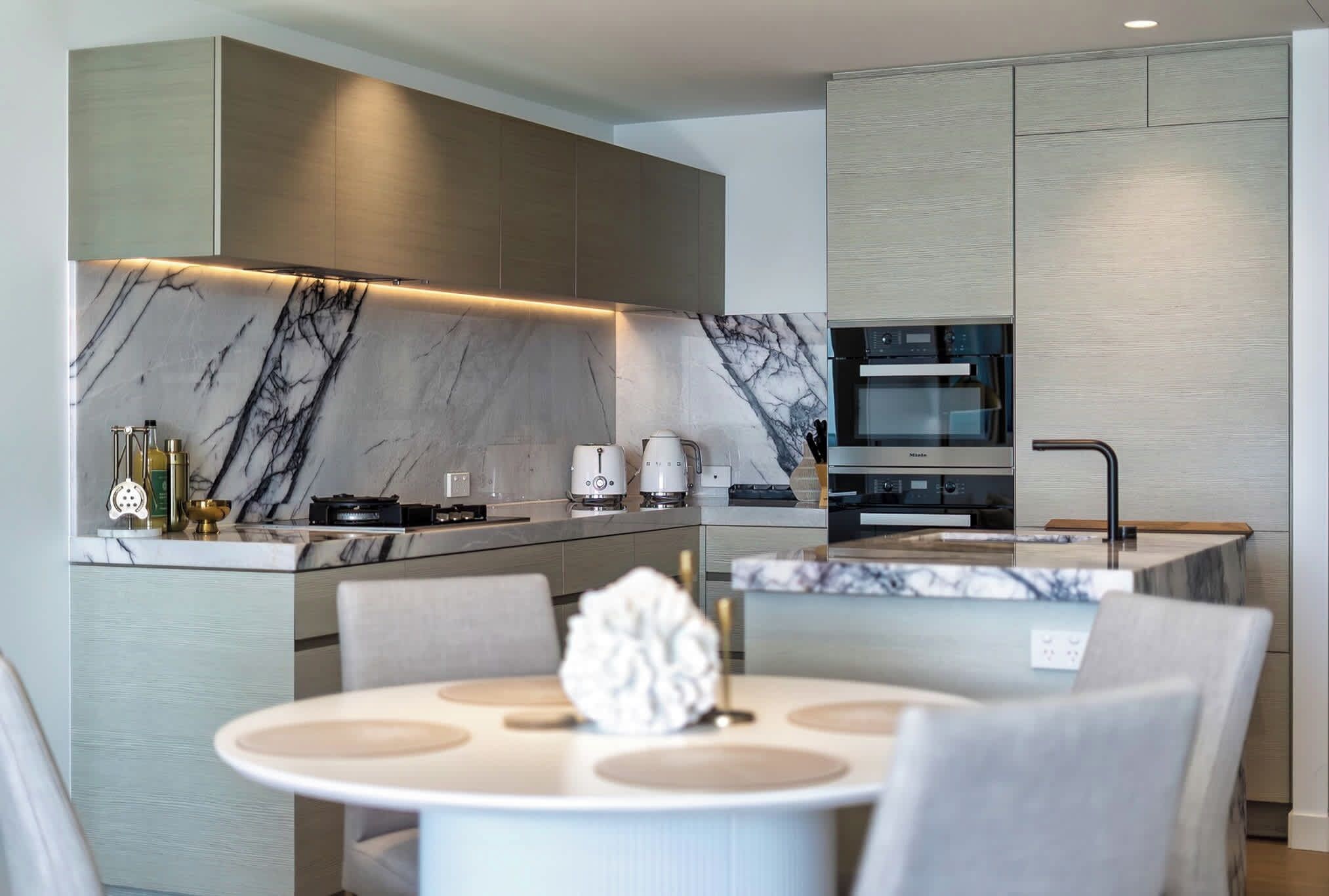 The modern kitchen has generous bench space and quality appliances for meals at home.