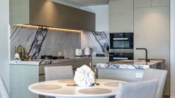 The modern kitchen has generous bench space and quality appliances for meals at home.