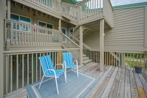 A multi-level deck with two chairs and a rug. - Closest Unit to Beach on Little Gasparilla Island (Placida)