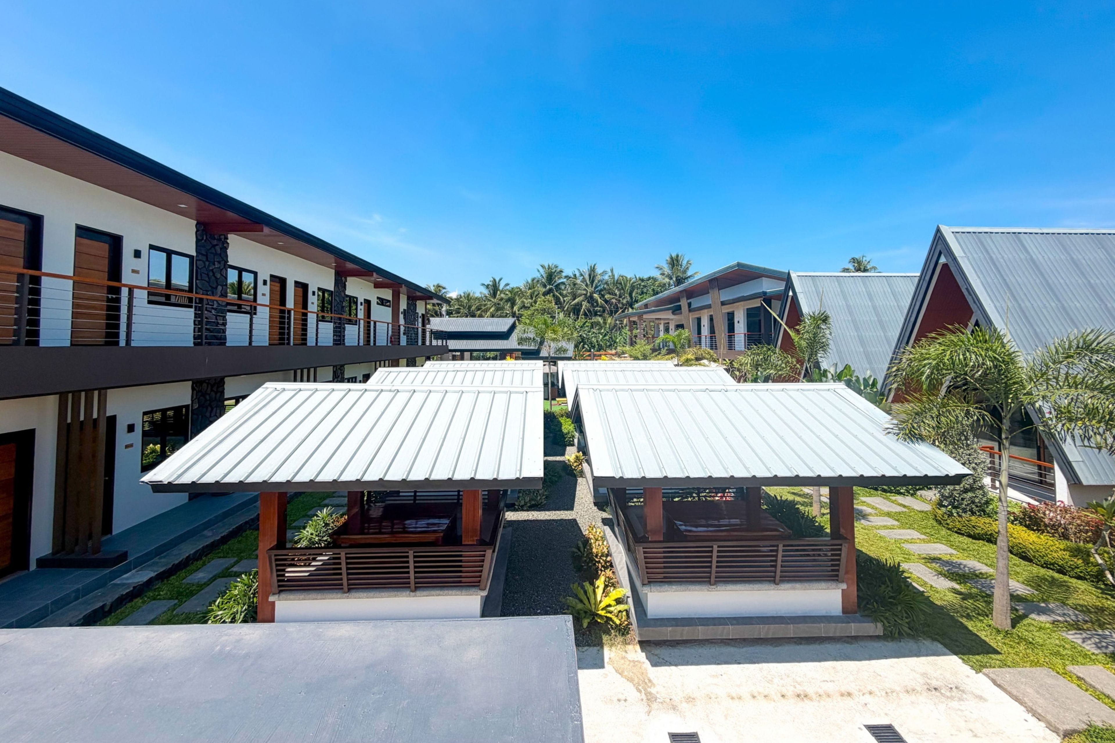 A modern building with multiple levels, featuring a mix of residential and commercial spaces.
