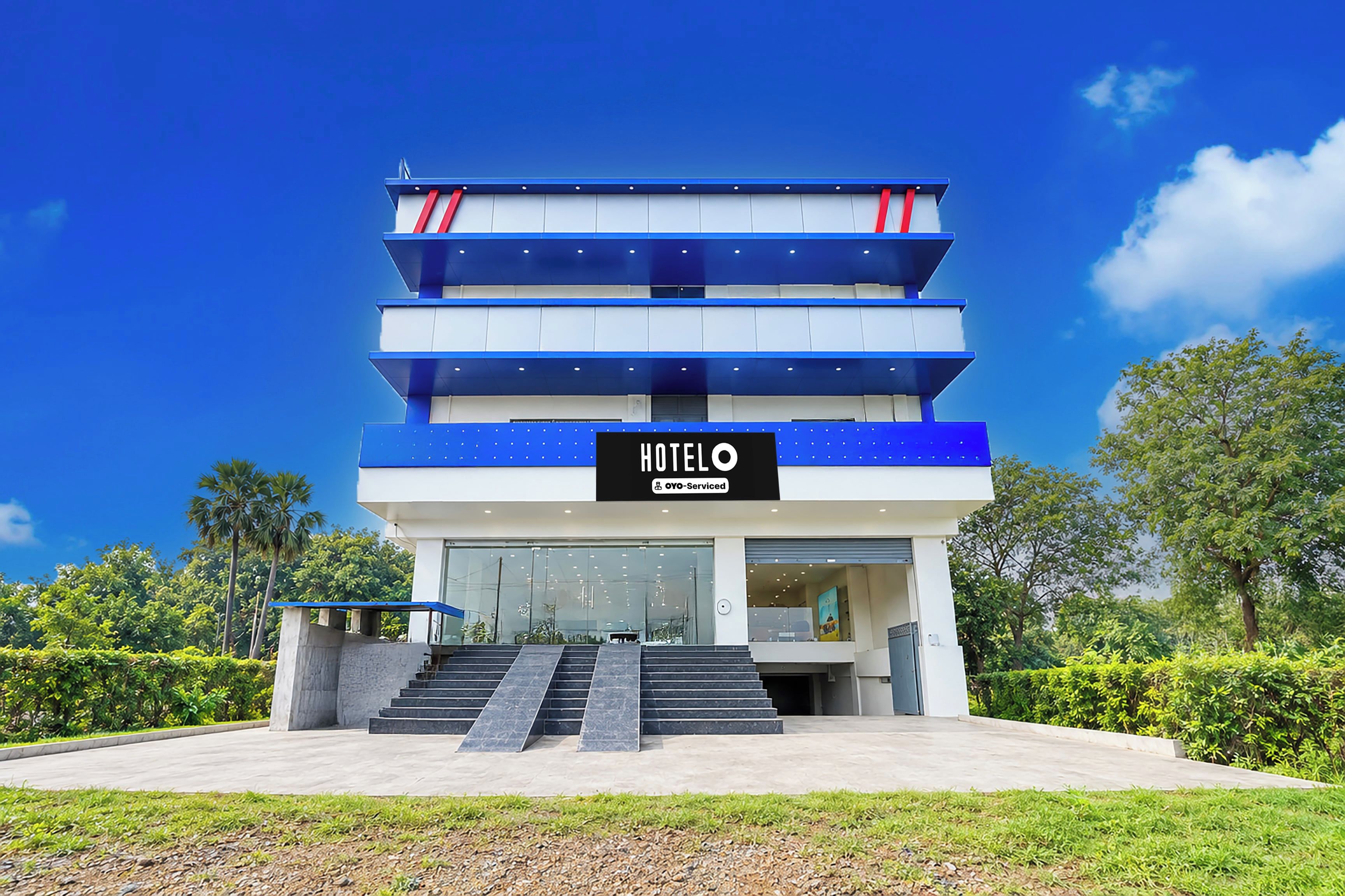 A multi-story hotel with a modern design, featuring a prominent 'HOTEL' sign on the facade.