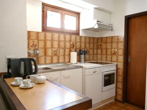 A compact kitchen with a coffee maker, tea set, and a Bosch oven. - Wonderful private villa for 4 guests with WIFI, TV and patio (Scona)