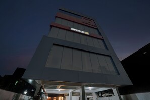 A modern hotel building with a prominent sign for 'TOWNHOUSE OAK' and a visible entrance. - Hotel O The Dev Regency  (Patna)
