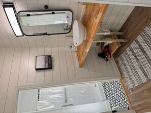 A bathroom with a shower, toilet, and sink. - Plush in the Pines! - 4BR + Game Room (Ladson)