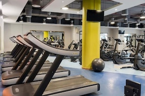 A gym with treadmills, exercise balls, and various fitness equipment. - FIRST CLASS |4BR| Vibrant Retreat Near JBR Beach (JBR)