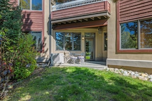 A modern two-story house with a covered patio, a large air conditioning unit, and a small garden area. - Near the Ski Area | Cozy Fireplace & Ski Shuttle (Steamboat Springs)