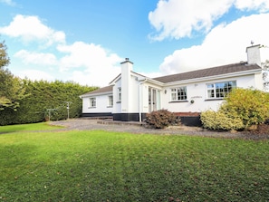A two-story house with a white exterior, a chimney, and a front door. - Cross Beg (Kilrush)