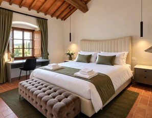 A bedroom with a large bed, a desk, and a window with curtains. - Villa Angelina (PROVINCIA DI AREZZO)