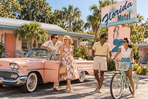 A vintage car parked in front of a motel with a sign that reads 'Florida Motel.' - Vintage Florida Motel | St. Augustine (St. Augustine)