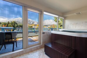 Soak in the hot tub while mountains frame the view. - 1 Bedroom Loft | Fireplace | Village Gate House by Whiski Jack (Whistler)