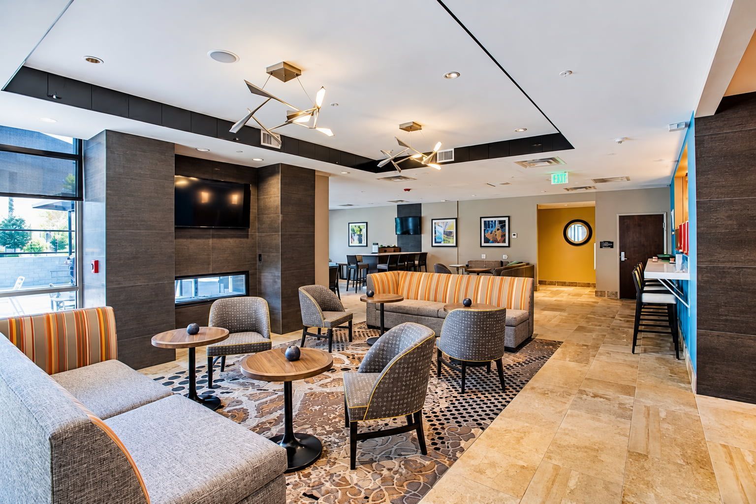 Lobby lounge with comfortable seating and a TV