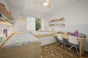 A bedroom with a bed, desk, chair, shelves, and a window. - Holiday Home 'Casa Arrels' with Montseny Views (Sant Julià d'Alfou)