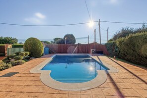 A rectangular swimming pool with a tiled deck surrounding it. - Holiday Home 'Casa Arrels' with Montseny Views (Sant Julià d'Alfou)