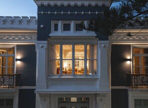 A building with a bay window, a balcony, and a door with a decorative design. - Victoria Mansion (Rodos)