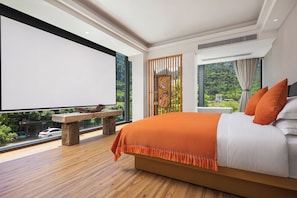 A modern bedroom with a large bed, a stone bench, and a view of greenery through large windows. - Chennianwangshiyisu (Guilin)