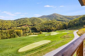 A golf course with a wooden deck overlooking the landscape. - Balsam Preserve Private Resort | Golf, Spa, Hiking (Sylva)