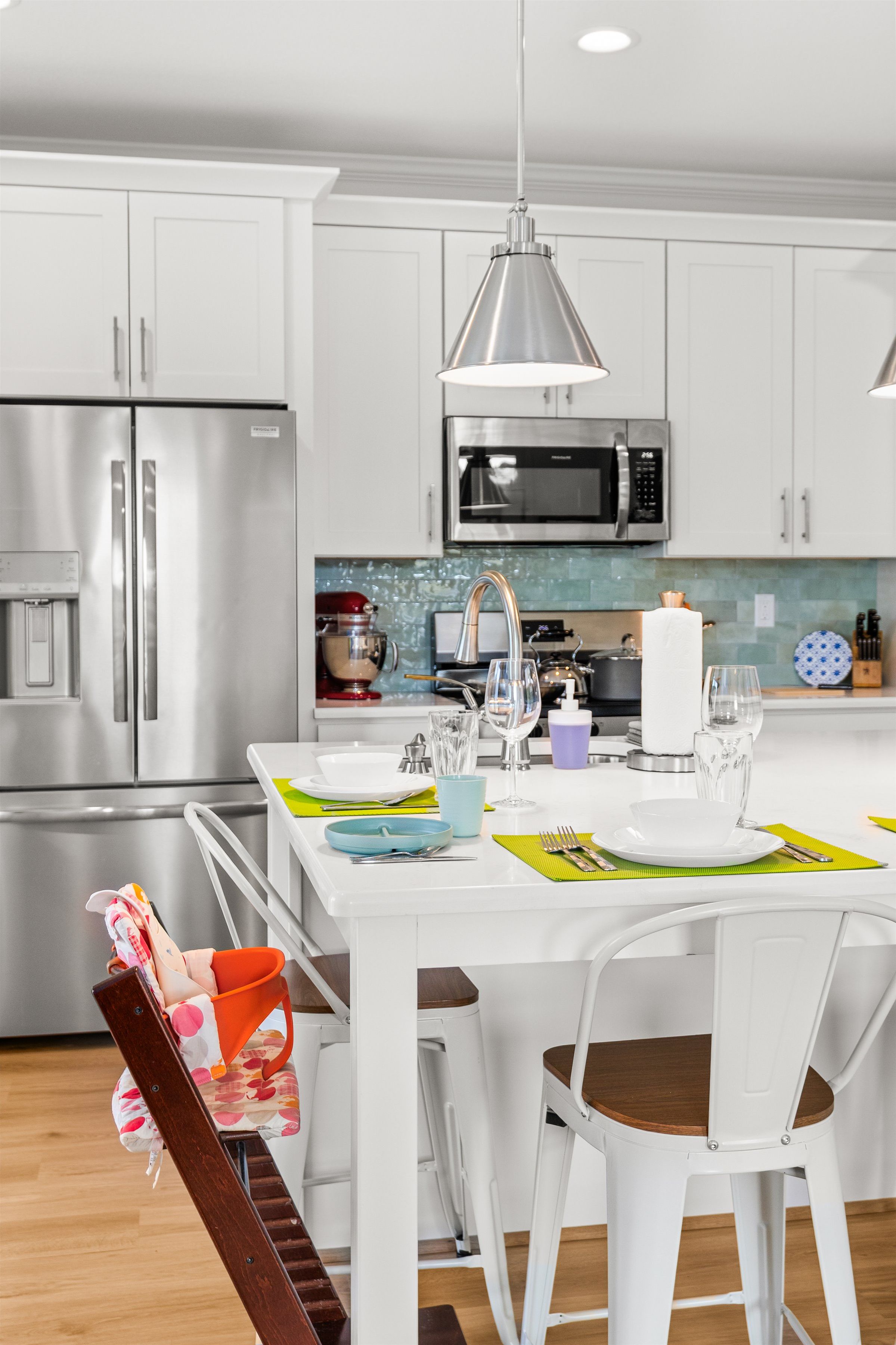 Bright modern kitchen with stainless appliances and family-friendly dining