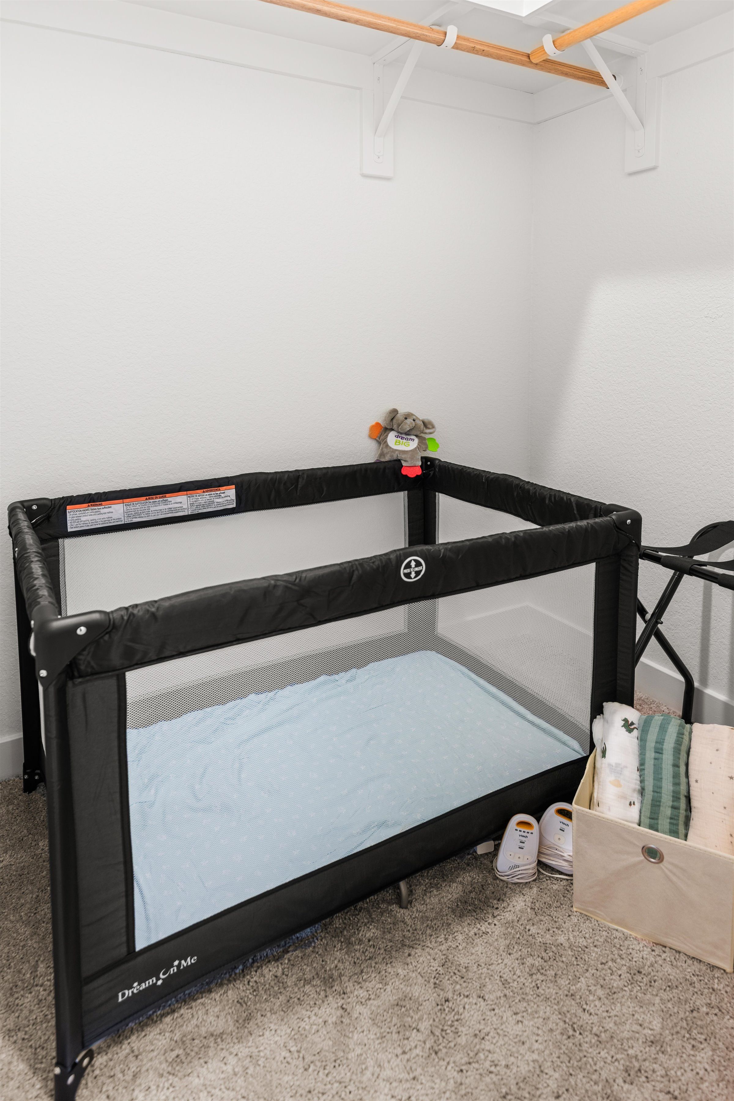 Family-friendly nursery nook with portable crib and baby essentials