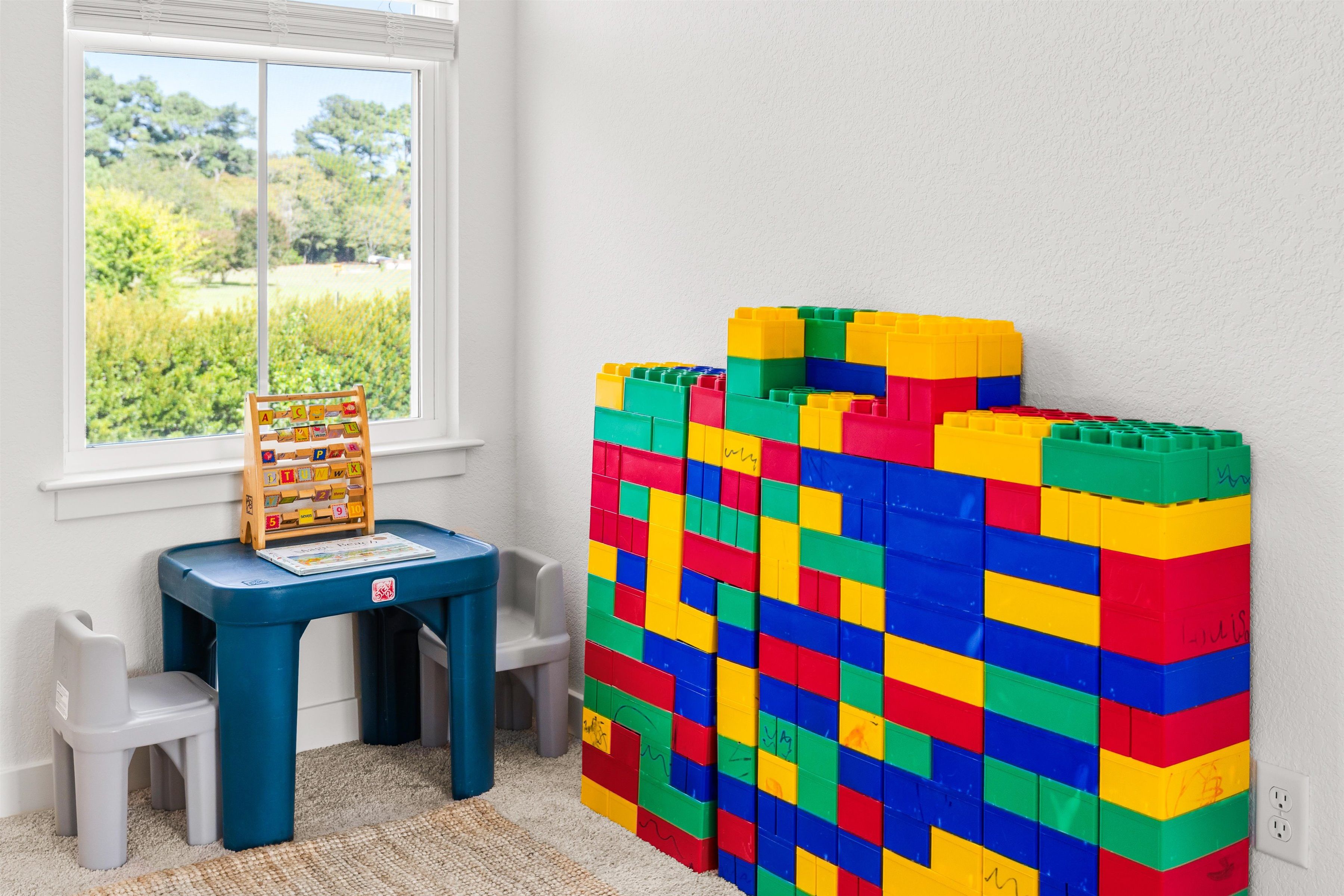 Bright kids’ play nook with activity table and colorful building blocks